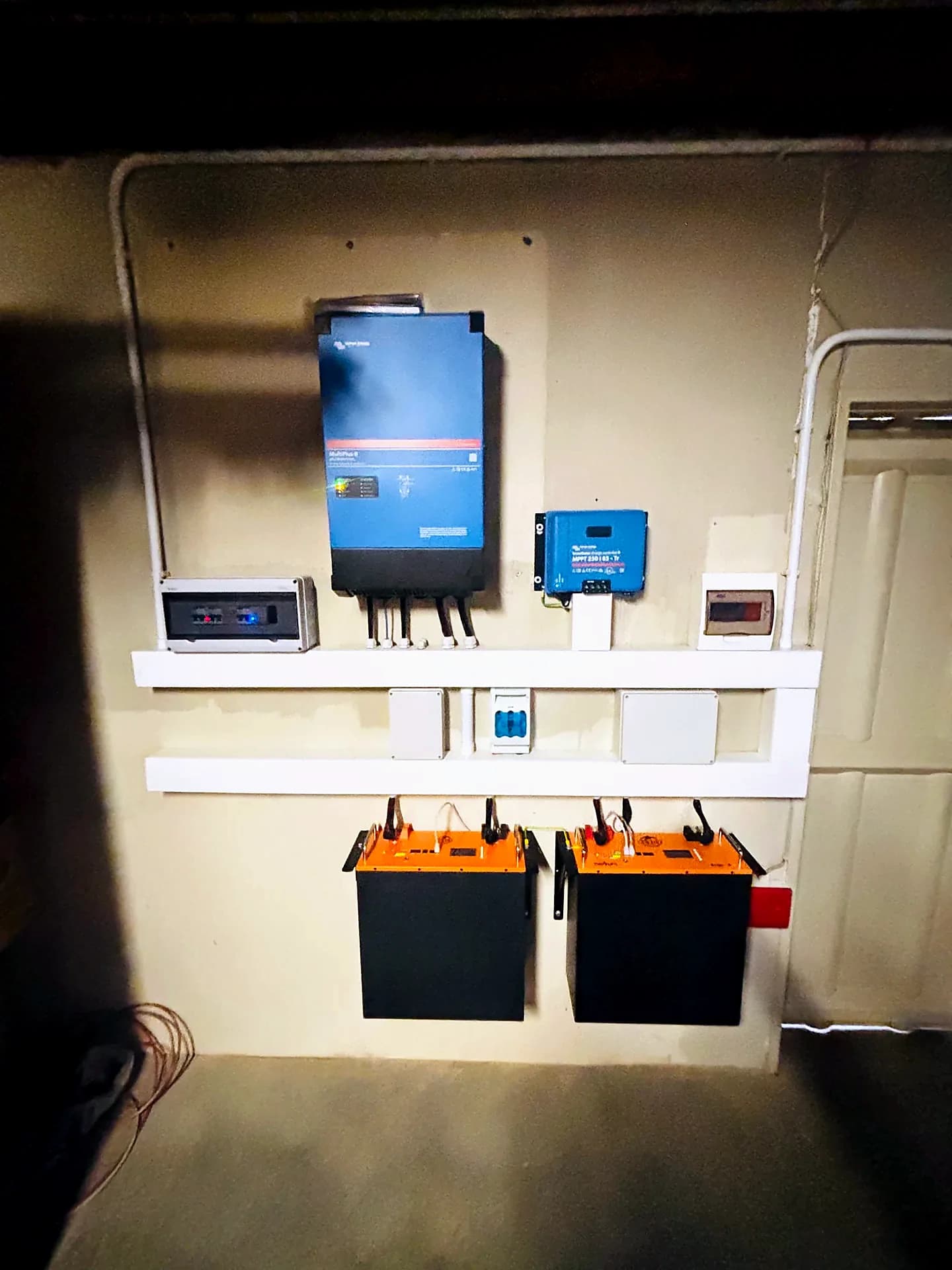 Completed Victron inverter and battery backup system mounted on a wall
