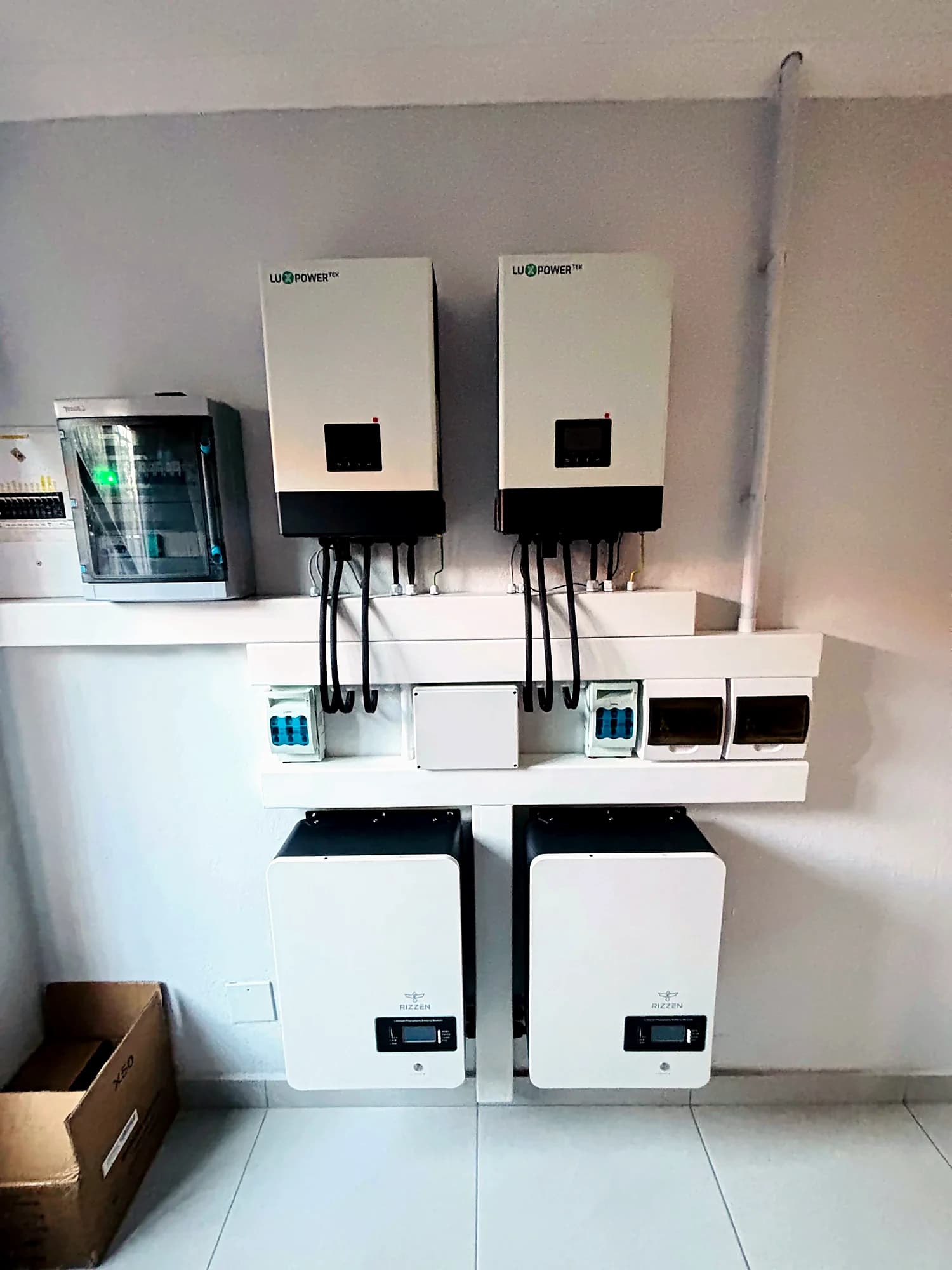 Completed dual-inverter home backup system with wall-mounted batteries