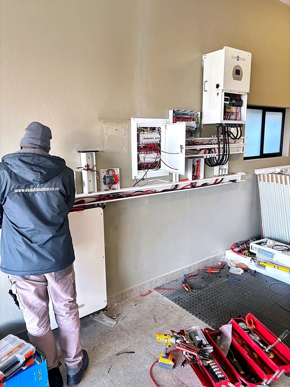 ES Automation installer wiring an inverter and protection boards on site